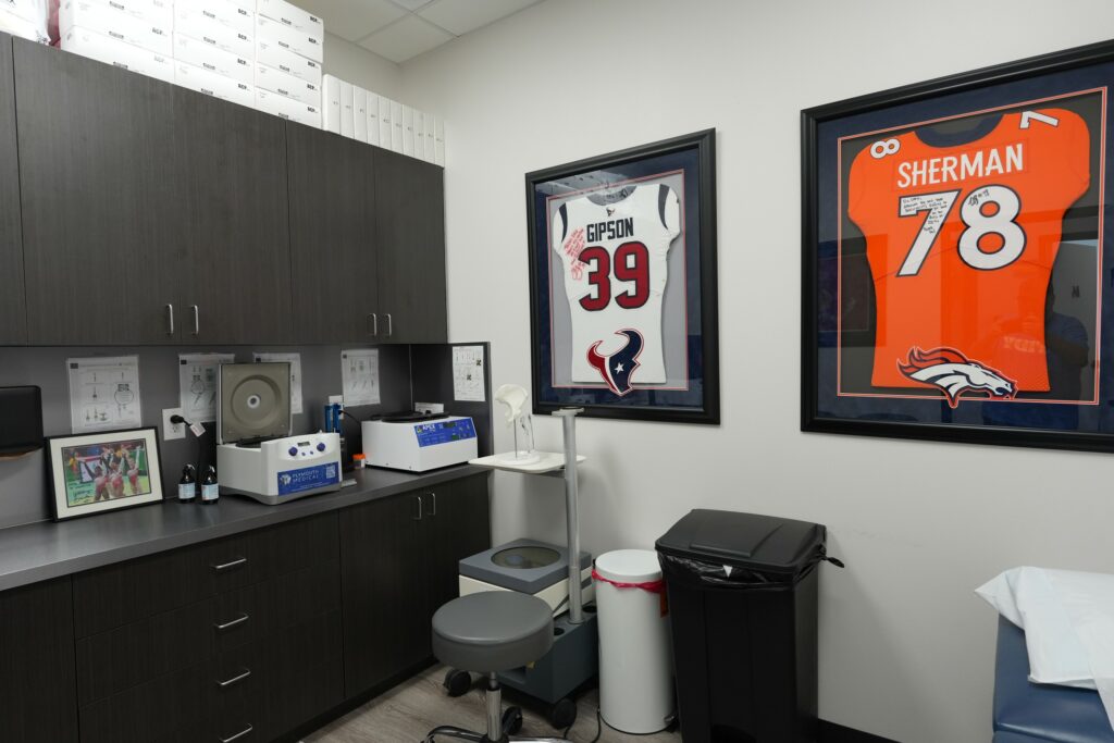 Clinic workroom with framed sports jerseys at Star Orthopedics in Frisco