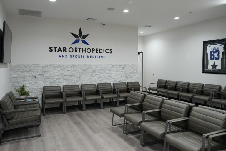 Waiting room with the Star Orthopedics and Sports Medicine logo wall