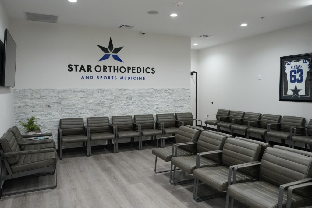Waiting room with the Star Orthopedics and Sports Medicine logo wall