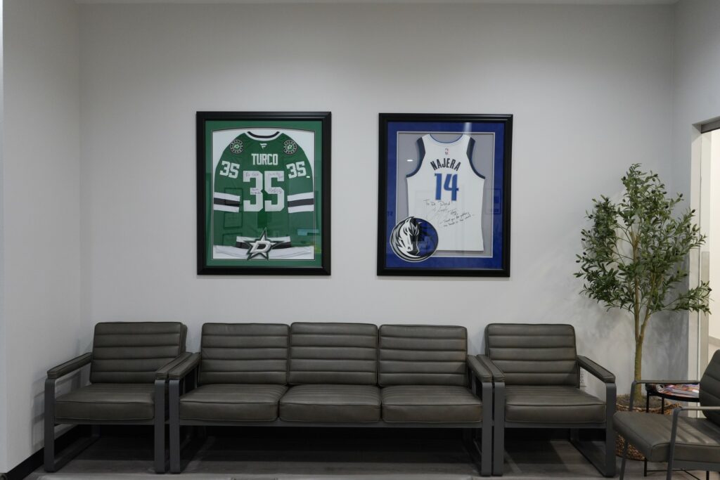 Waiting area with framed sports jerseys at Star Orthopedics in Frisco