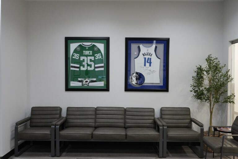 Waiting area with framed sports jerseys at Star Orthopedics in Frisco