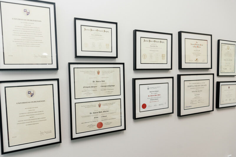 Wall of Dr. Andrew Dold's diplomas and board certifications