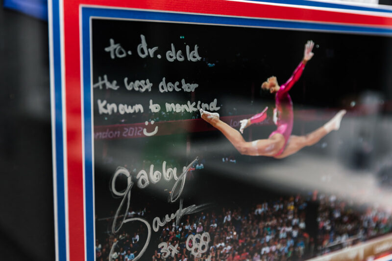 Signed London 2012 Olympic gymnastics photo with a note to Dr. Dold