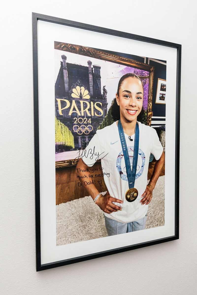Signed Paris 2024 Olympic gymnastics photo with a note to Dr. Dold