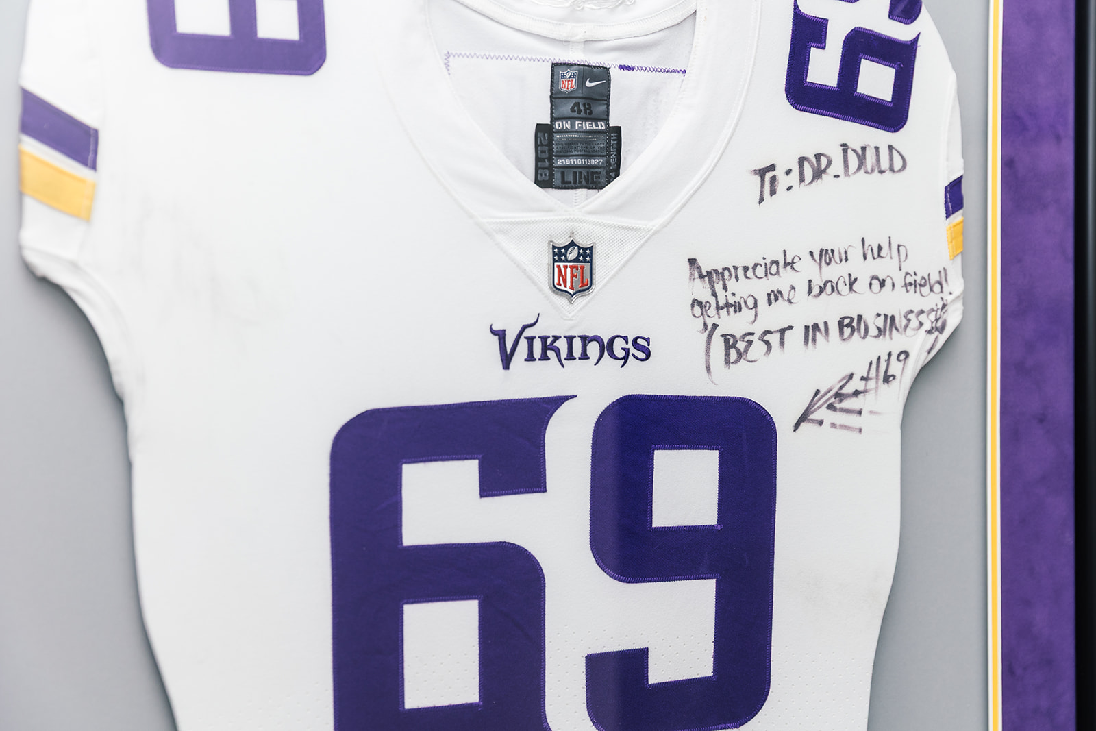 Signed Minnesota Vikings jersey with a note to Dr. Dold in his Frisco office