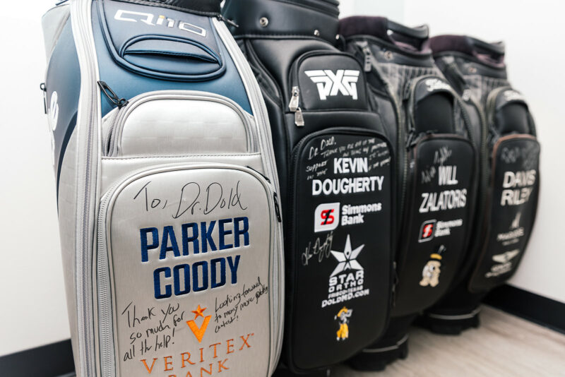 Signed PGA Tour golf bags with notes to Dr. Dold