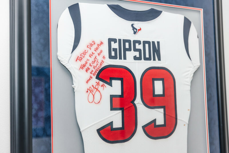 Signed Houston Texans jersey with a note to Dr. Dold