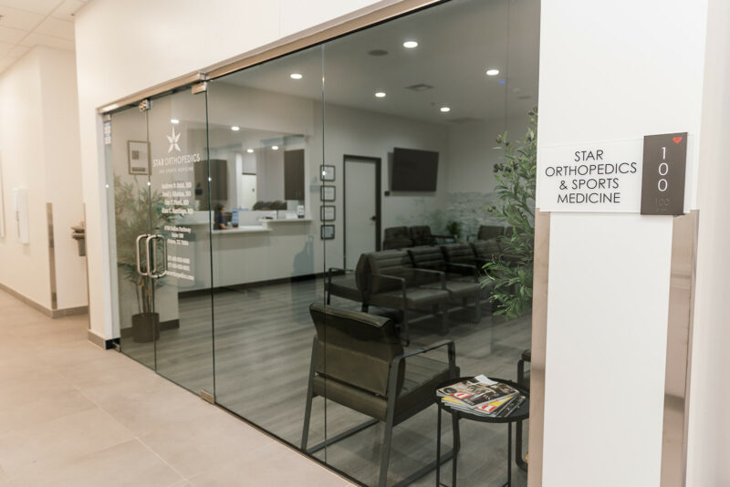 Entrance to the Star Orthopedics office in Frisco with the Suite 100 sign